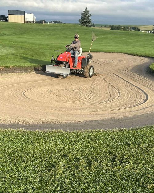 Beaver Dam Golf sand pit raking